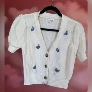 Women’s Medium Short Sleeve Sweater by Hooked Up. Butterfly detail.